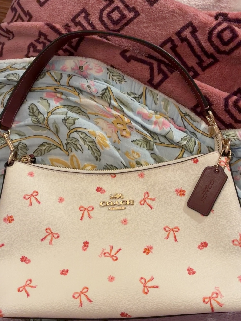 COACH Cream Shoulder Bag with Pink Bow Print and Brown Strap